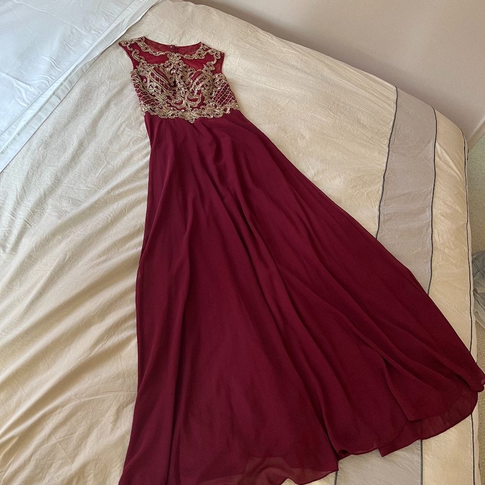 Long, formal burgundy dress with gold detail
